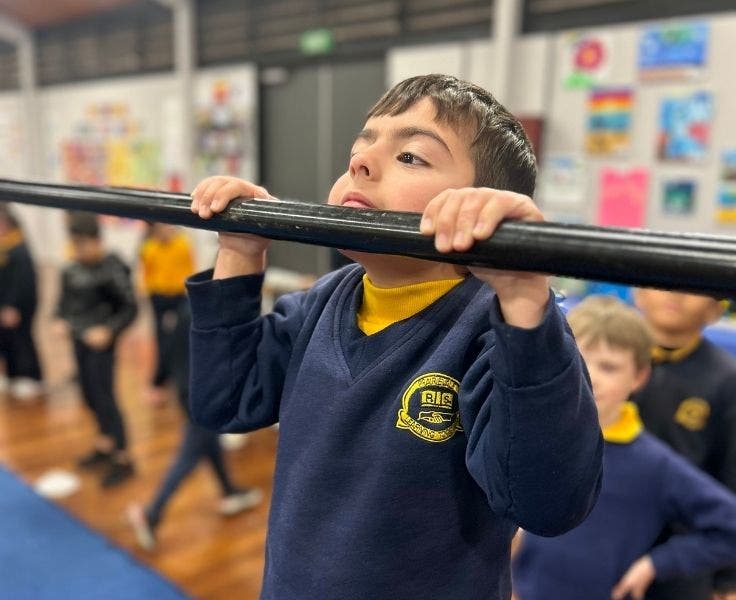 Student doing gymnastics.