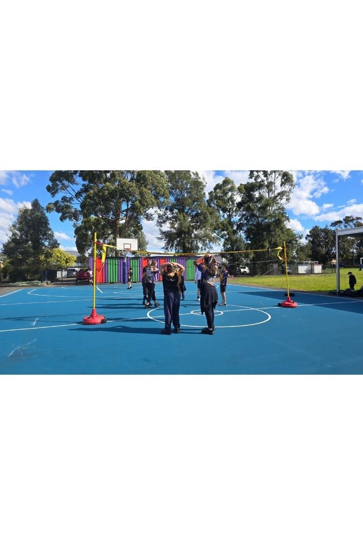 Students playing volleyball.