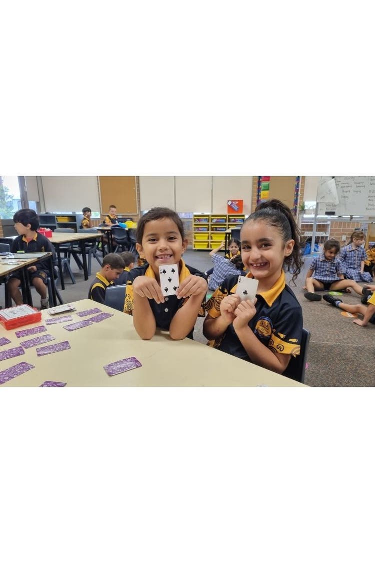 Students playing a maths game in classroom.