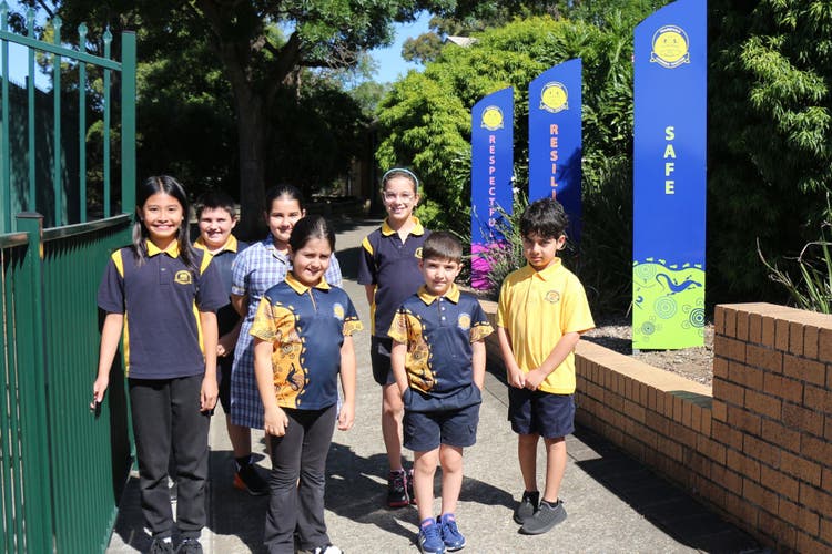 Students at front of school
